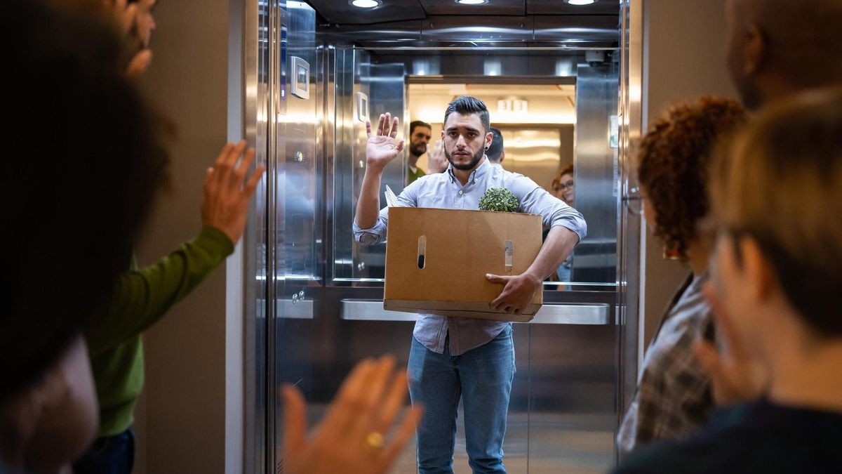 Man being fired at his job and leaving the office